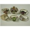 Image 1 : Six gemset rings: peridot and diamond set in 18ct gold, amethyst and citrine solitaires, a gar...