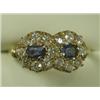 Image 1 : A sapphire and diamond cluster ring, hallmarked 18ct gold, Chester 1909, size R Est. 400/600...