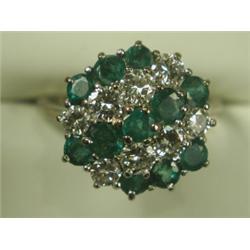 An emerald and diamond cluster ring set in 18ct white gold, size L Est. 400/500...