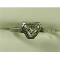 A diamond solitaire ring set with a triangular stone in white metal (tests platinum), size M<b...