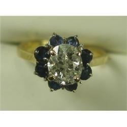A diamond and sapphire cluster ring set with an old mine cut stone of approx 1.25cts set in, 1...