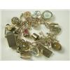 Image 1 : A 9ct gold charm bracelet with 19 various charms, heart padlock and safety chain, 16cm long<br...