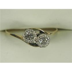 A diamond crossover ring illusion set in white with two stones of approx 0.15ct each to an 18c...