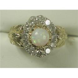 An opal and diamond cluster ring set with approx 1.2ct of diamonds in 18ct gold, size N Est...