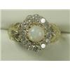 Image 1 : An opal and diamond cluster ring set with approx 1.2ct of diamonds in 18ct gold, size N Est...