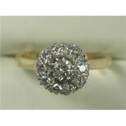 A diamond cluster ring (total approx 0.75ct), set in 18ct gold, size L Est. 300/400...