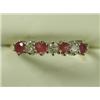 Image 1 : A diamond and ruby half eternity ring set in 18ct gold, size M Est. 125/175...