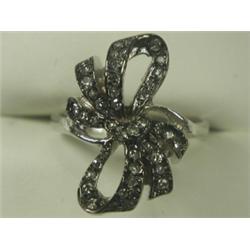 A diamond bow ring set with eight cut stones in 18ct white gold, size M 1/2 Est. 100/150...