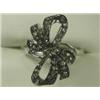 Image 1 : A diamond bow ring set with eight cut stones in 18ct white gold, size M 1/2 Est. 100/150...