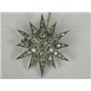 Image 1 : A Victorian diamond star brooch set with old cut stones, 3.5cm in diameter, with a safety chai...