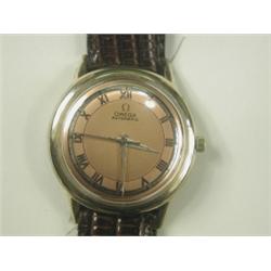 A 1960s gents Omega automatic watch with a coppered and silvered dial, 10k gold filled bezel,...