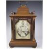 Image 1 : A Victorian walnut bracket clock with an eight day quarter hour chiming movement, with pierced...
