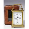 Image 1 : A small early 20th Century carriage clock with an enamel dial and subsidiary alarm dial, and a...