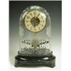 Image 1 : A 1920s Bulle patent electric brass mantel clock on an ebonised plinth base, with battery hous...