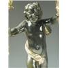 Image 2 : A pair of bronze figural candelabra, each in the form of a black patinated cherub holding two...