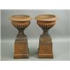 Image 1 : A pair of early 20th Century terracotta garden urns on raised plinths. 85cms high Est. 250/...