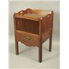 Image 1 : An early 19th Century mahogany tray top commode, with a tambour door, and a pull out drawer, o...