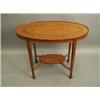 Image 1 : An Edwardian satinwood veneered oval table, the top and lower shelf inlaid with leaf and ribbo...
