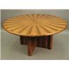 Image 1 : A modern Gordon Russell circular table, the top in segmental rosewood veneer, on a cross shape...