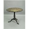 Image 1 : A mahogany tripod table, the one piece top with an applied carved Chippendale shaped border on...