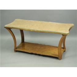 An Art Deco burrwood veneered coffee table, the top of shaped rectangular form, on swept legs,...