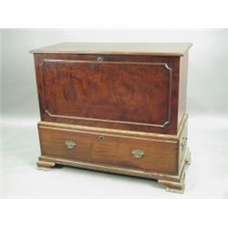 A 19th Century solid mahogany mule chest with a hinged lid over a panelled front on a stand wi...