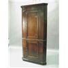 Image 1 : A George III oak free standing corner cupboard, each panelled door opening to reveal traces of...