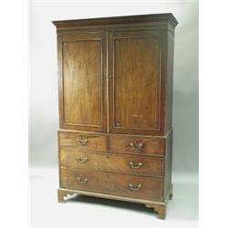 A 19th Century mahogany linen press, with an inlaid cornice and panels, over two base drawers;...
