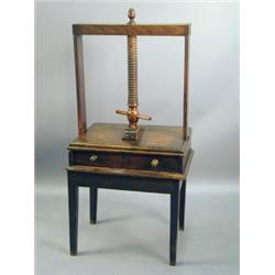 An early 18th Century oak and fruitwood linen press, with an acorn finial, and single drawer,...