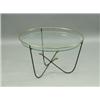 Image 1 : A 1950's iron and brass 'Atom' table, with a circular glass top, retailed by Heals, 66.5cm dia...