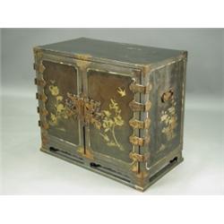 An Edo period lacquer cabinet, the two doors decorated on both sides with birds and foliage, a...