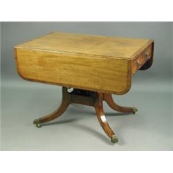 A 19th Century crossbanded mahogany Pembroke table, with two frieze drawers, raised on unusual...