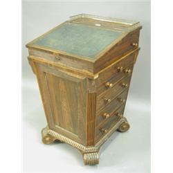 A Regency rosewood Davenport of tapering square shape the sliding slope with a three quarter b...