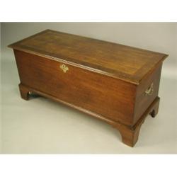 An 18th Century red walnut blanket chest, with a crossbanded top and three small internal draw...