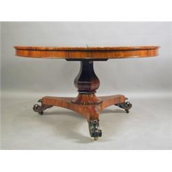 A Victorian circular rosewood dining table, the top on a hexagonal baluster column and a large...
