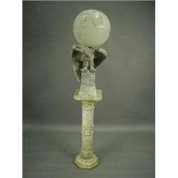 An unusual Irish marble pedestal lamp carved as an eagle supporting an alabaster globe shaped...
