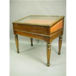 A Victorian mahogany table display cabinet, with a slanted top on turned legs, 125cm wide x 79...