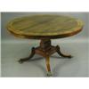 Image 1 : A Regency rosewood circular tilt top dining table, the crossbanded top with brass stringing an...