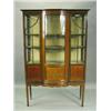 Image 1 : An Edwardian inlaid mahogany display cabinet with a central bow front glazed section with door...