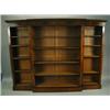 Image 1 : A 19th Century style mahogany breakfront open bookcase with a moulded cornice over adjustable...