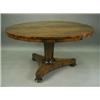 Image 1 : A Victorian rosewood circular top centre table, on an octagonal tapering column, a triform bas...
