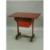Image 1 : A William IV mahogany work table with a fold over top, frieze drawer and work basket on carved...