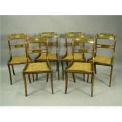 A set of six Regency rosewood bar back single dining chairs each having gadrooned and scrollin...