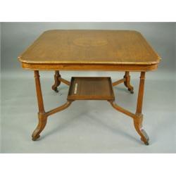 A late Victorian satinwood centre table, the square top with strung and crossbanded decoration...