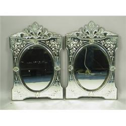 A pair of early 20th Century Venetian glass wall mirrors, of rectangular form, with an oval pl...