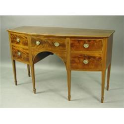 An 1920s crossbanded mahogany bow front sideboard, by Redman and Hales, with a drawer between...