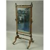 Image 1 : A Regency mahogany cheval mirror, with urn shaped finials surmounting the bobbin-turned and pa...