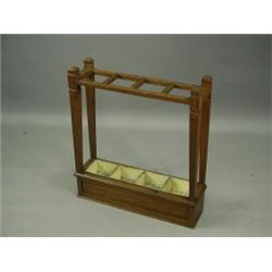 An oak umbrella stand with four divisions, 63cm wide Est. 80/120...