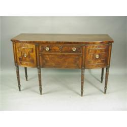 A George III mahogany bow front sideboard with two cellaret drawers and two central drawers wi...
