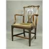 Image 1 : An 18th Century mahogany elbow chair, with a carved and pierced splat, scroll 'ears' and a dro...